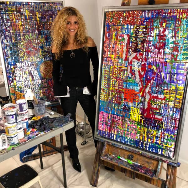 Ronit Galazan with two commission paintings